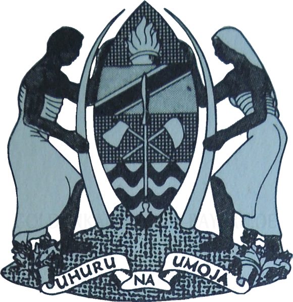 Das Bild zeigt das Staatswappen von Tansania in Ostafrika. Stosszähne, ein Speer und das Wappen von zwei Menschen gehalten.